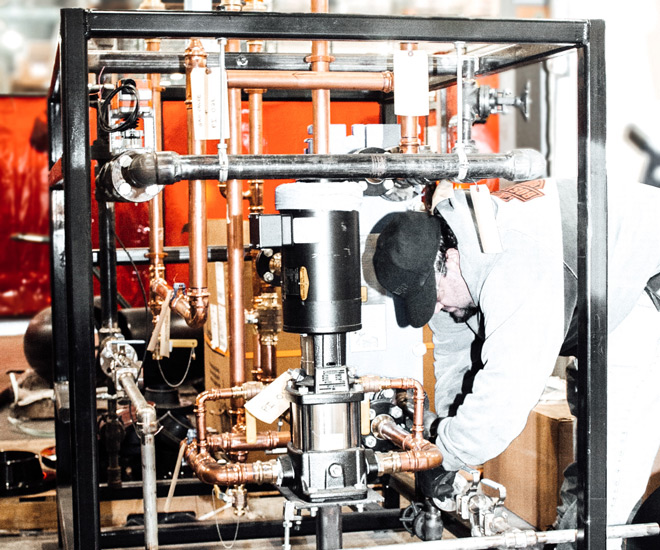 Man working on heat exchanger